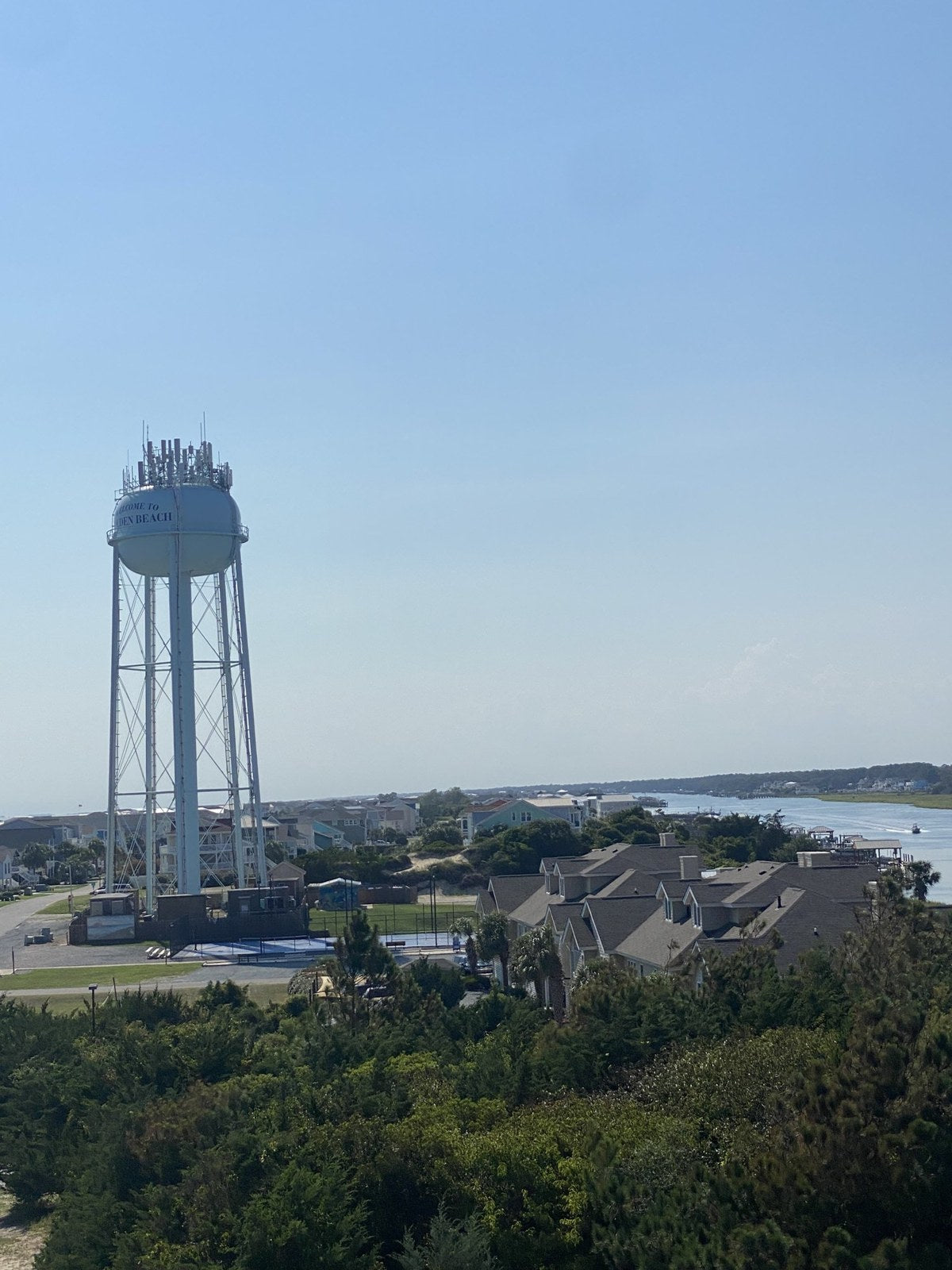 An island overlook with houses, a water tower and the waterway beyond